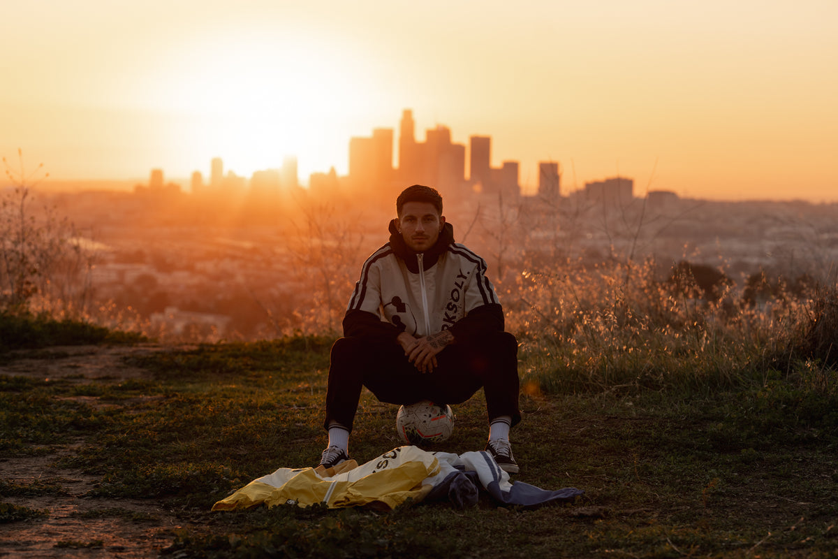 CVY athlete overlooking the Los Angeles skyline at sunset
