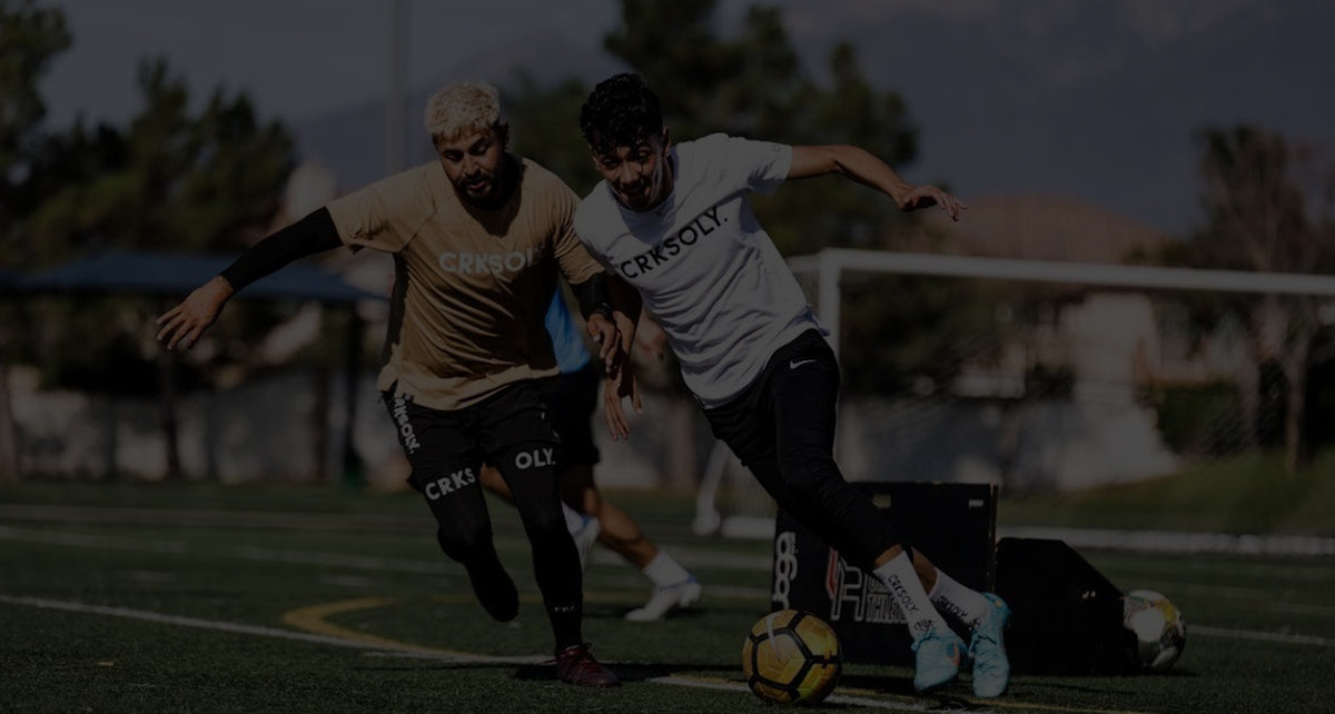 Players in CVY gear during a night soccer match